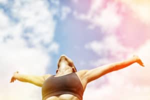 woman raised her arms and relaxing